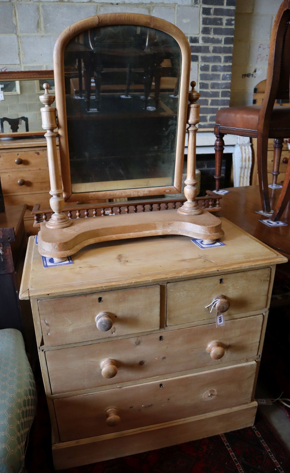 A late Victorian pine four drawer chest, width 83cm, depth 45cm, height 77cm together with a pine toilet mirror
